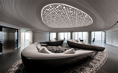 Curved lounge seating area inside Burj Khalifa At The Top