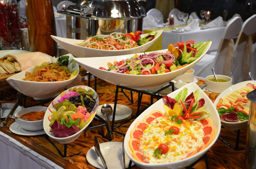 International buffet spread of salads and appetisers served on board