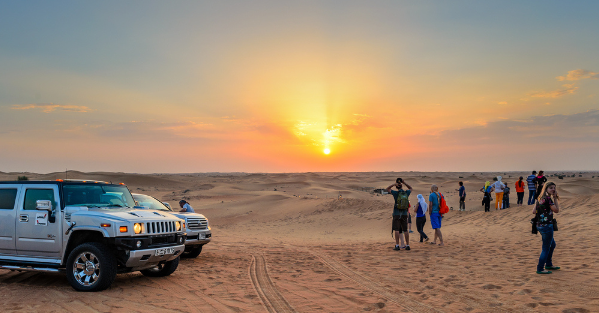 Sunrise light over the red dunes during a Red Dunes Desert Safari Dubai morning tour
